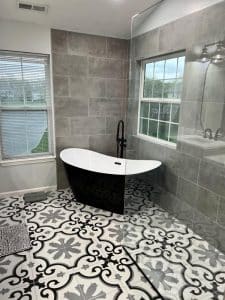 This image features a black and white claw foot tub.