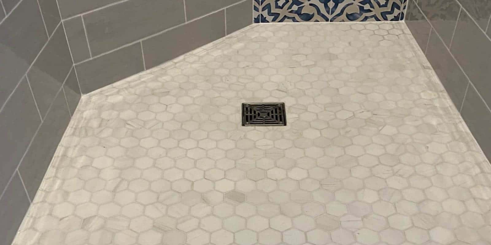 barrier free shower with porcelain tile and glass enclosure