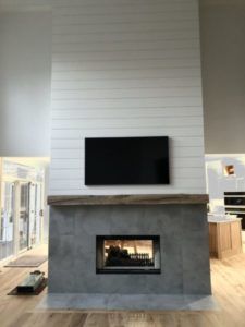 Cozy living room fireplace in fireplace designs in Anderson, IN with warm decor