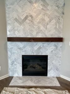 Modern wall-mounted fireplace in a minimalist living room interior