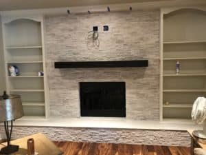 Modern living room fireplace in Anderson, IN with warm lighting and cozy interior design