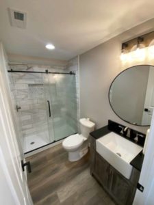 Modern shower remodel pricing in Indiana with glass enclosure and updated vanity