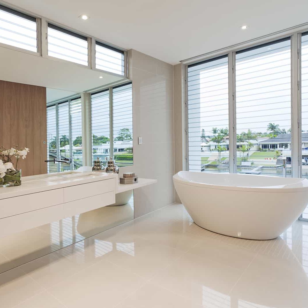 This image features a stand alone, claw foot tub.